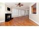 Open-concept living room with fireplace, hardwood floors, and natural light at 3894 Stone Lake Nw Dr, Kennesaw, GA 30152