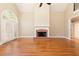 Living room with brick fireplace and French doors at 3894 Stone Lake Nw Dr, Kennesaw, GA 30152