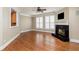 Living room featuring hardwood floors, fireplace, and natural light at 3894 Stone Lake Nw Dr, Kennesaw, GA 30152