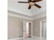 Main bedroom with a ceiling fan, trey ceiling, and view of attached bathroom at 3894 Stone Lake Nw Dr, Kennesaw, GA 30152