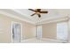 Main bedroom with a ceiling fan, trey ceiling, and attached bathroom at 3894 Stone Lake Nw Dr, Kennesaw, GA 30152