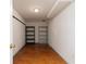 A storage room with white walls and stained concrete floors and shelving units at 3894 Stone Lake Nw Dr, Kennesaw, GA 30152