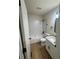 Beautifully renovated bathroom with a shower-tub combo and white tiled walls at 1753 Lee St, Decatur, GA 30035