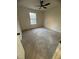 Bright bedroom featuring a ceiling fan, large windows with natural light, and neutral carpet at 1753 Lee St, Decatur, GA 30035