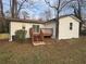 Exterior view of the rear of this home showing a nice deck and door to the backyard at 1753 Lee St, Decatur, GA 30035