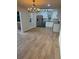 Open concept kitchen with stainless appliances, granite counters, and bright lighting at 1753 Lee St, Decatur, GA 30035