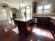 Modern kitchen featuring dark wood cabinets, granite counters, and a central island with pendant lighting at 2481 Tack Hill Ct, Dacula, GA 30019