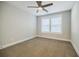 Clean bedroom with a ceiling fan and bright window, creating a serene environment at 5328 Monticello Dr, Villa Rica, GA 30180