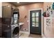 Bright laundry room with modern washer and dryer, custom storage, and stylish design at 720 Weybridge Pl, Alpharetta, GA 30022