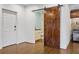 Adjacent to the bar is this convenient powder room with modern fixtures and a barn door at 720 Weybridge Pl, Alpharetta, GA 30022