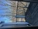 Exterior shot of balcony with black metal railing and bare trees at 898 Oak # 3421, Atlanta, GA 30310