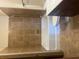 Well-lit bathroom featuring tiled shower/tub combo, white toilet, and tiled flooring at 898 Oak # 3421, Atlanta, GA 30310