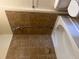 Bathroom featuring a bathtub, tiled walls, and shower at 898 Oak # 3421, Atlanta, GA 30310