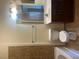 Bathroom featuring a sink, toilet, and vanity with dark wood finish at 898 Oak # 3421, Atlanta, GA 30310