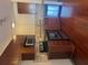 A modern kitchen featuring stainless steel appliances, tile backsplash and dark wood cabinets at 898 Oak # 3421, Atlanta, GA 30310