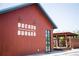 Cozy burger joint exterior with a rustic pergola and outdoor seating area at 2315 Park Walke Dr, Alpharetta, GA 30009