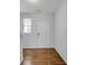 Bright entryway featuring wood-look floors and white walls, leading to a welcoming interior at 3232 Tarian Way, Decatur, GA 30034