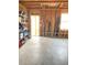 Unfinished basement with open ceiling, concrete floor, and door to backyard at 526 Blue Mountain Rise, Canton, GA 30114