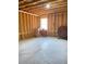 Unfinished basement with exposed beams and a small window at 526 Blue Mountain Rise, Canton, GA 30114