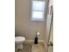 Small bathroom with neutral paint and toilet paper stand at 526 Blue Mountain Rise, Canton, GA 30114