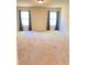 Spacious bedroom with carpeted floors and bright natural lighting at 526 Blue Mountain Rise, Canton, GA 30114