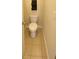 Brightly lit toilet with a tile floor and accessories at 526 Blue Mountain Rise, Canton, GA 30114
