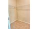 Well-lit walk-in closet featuring neutral walls and carpeted floors with white wire shelving installed around the perimeter at 526 Blue Mountain Rise, Canton, GA 30114