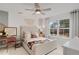 Bright bedroom with neutral décor, ceiling fan, and large window views at 6095 Marigold Way, Atlanta, GA 30349