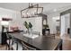 Dining room with a modern chandelier, a large table, and neutral decor at 6095 Marigold Way, Atlanta, GA 30349