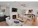 Bright living room with fireplace, hardwood floors, and stylish furniture at 6095 Marigold Way, Atlanta, GA 30349