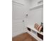 Mudroom with a built in bench, storage baskets, and stylish decor at 6095 Marigold Way, Atlanta, GA 30349