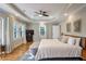 This is a light and airy main bedroom with a tray ceiling and large windows for natural light at 680 Blake Se Ave, Atlanta, GA 30316