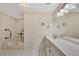 The white bathroom offers a tub and a vanity with a mirror at 1281 Whitlock Ridge Sw Dr, Marietta, GA 30064