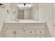 Bathroom vanity featuring white cabinetry, drawers, and a framed mirror at 1281 Whitlock Ridge Sw Dr, Marietta, GA 30064