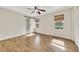 Bedroom featuring hardwood floors, natural light, and a sliding barn door to the bathroom at 1281 Whitlock Ridge Sw Dr, Marietta, GA 30064