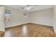 Bright bedroom featuring hardwood floors, a ceiling fan, and natural light from the windows at 1281 Whitlock Ridge Sw Dr, Marietta, GA 30064