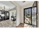 View from entryway into updated kitchen with black appliances and laminate flooring at 1281 Whitlock Ridge Sw Dr, Marietta, GA 30064