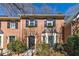 Charming brick townhome featuring black shutters and manicured landscaping at 1281 Whitlock Ridge Sw Dr, Marietta, GA 30064