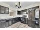 Updated kitchen featuring black appliances, laminate floors, and ample counter space at 1281 Whitlock Ridge Sw Dr, Marietta, GA 30064