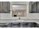 Kitchen view featuring stainless steel faucet and connecting window into living room at 1281 Whitlock Ridge Sw Dr, Marietta, GA 30064