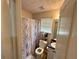 Standard bathroom with toilet, sink and a shower curtain at 6497 Snowden Dr, South Fulton, GA 30349