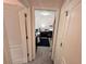 View into a carpeted bedroom featuring a patterned quilt bed and desk at 6497 Snowden Dr, South Fulton, GA 30349