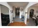 Inviting entryway with hardwood floors and decorative archways into adjacent rooms at 6497 Snowden Dr, South Fulton, GA 30349