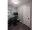 Home office featuring a workspace, natural light from the window, and modern decor at 6977 Eunice Dr, Riverdale, GA 30274