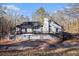 Aerial view showing large deck and outdoor living space surrounding the house at 1675 Dodson Sw Dr, Atlanta, GA 30311