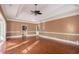 Spacious living room featuring hardwood floors, decorative molding, and an open layout at 1675 Dodson Sw Dr, Atlanta, GA 30311