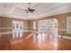 Open-concept living area featuring hardwood floors, decorative molding, and abundant natural light at 1675 Dodson Sw Dr, Atlanta, GA 30311