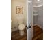 Bathroom features a toilet, storage closet with shelving, and modern fixtures for added convenience at 493 Willow Springs Dr, Marietta, GA 30068