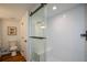 Modern bathroom features a glass shower with a sleek black sliding door and a built-in bench at 493 Willow Springs Dr, Marietta, GA 30068