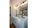 Bathroom featuring a double sink vanity and a glass enclosed shower at 493 Willow Springs Dr, Marietta, GA 30068